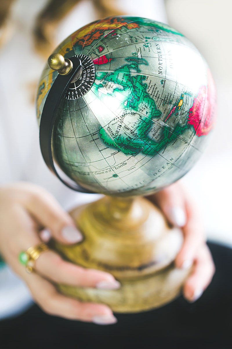 hands holding a globe