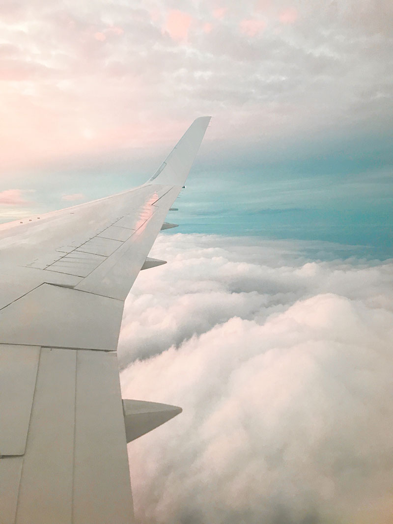 plane flying above the clouds