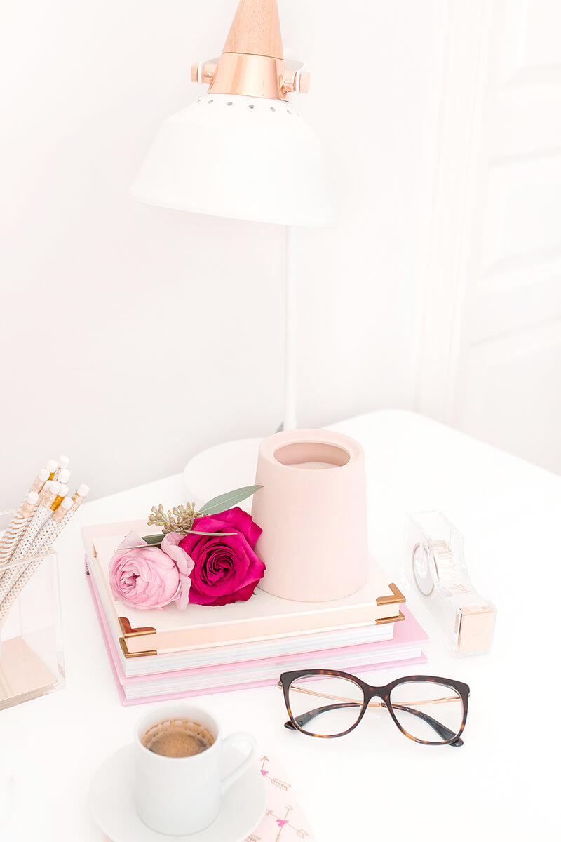 books and glasses on a desk